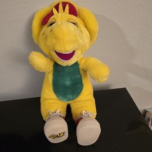 It's Bj the dinosaur off the barney and friends.